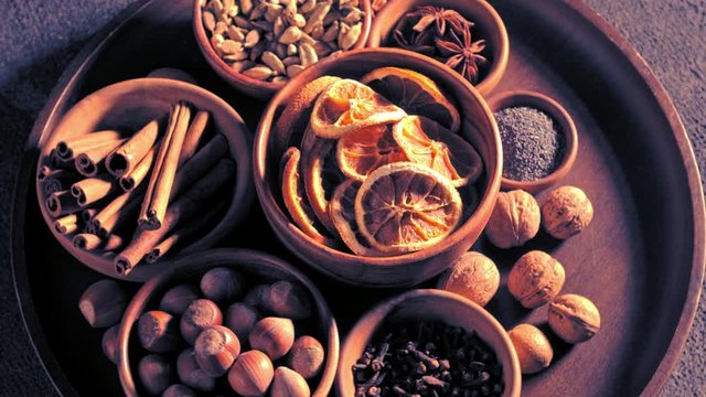 Top view of spices in bowls spinning on the table