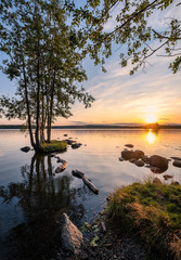 Idyllic landscape with beautiful sunset and tranquil mood at summer evening in Loppi, Finland