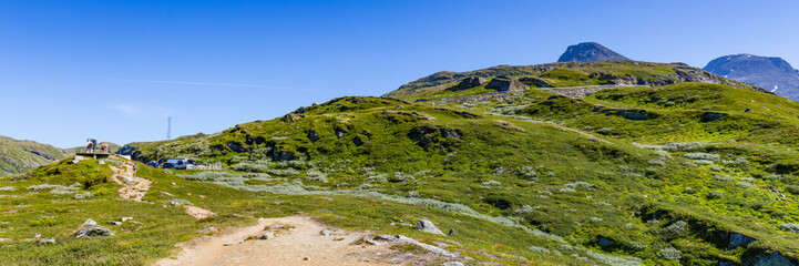 Fototapeta premium View on hairpin road from viewpoint Nedre Oscarshaug along National scenic route Sognefjellet between Skjolden and Lorn in in Western Norway.