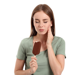 Young woman with sensitive teeth and cold ice-cream on white background