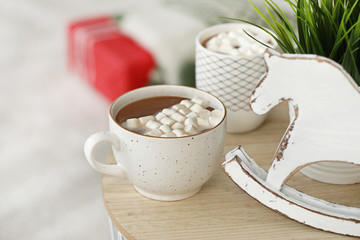 Cups of tasty hot chocolate on table