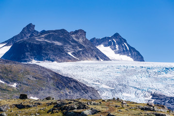 Fototapeta premium View Krossbu glacier Smorstabbrean from Sognefjellshytta along National scenic route Sognefjellet between Skjolden and in Western Norway.