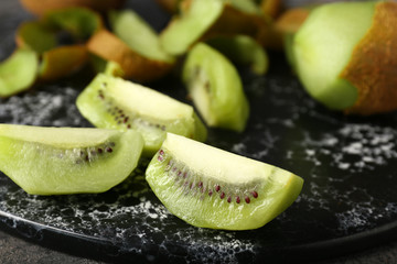 Tasty ripe kiwi on table, closeup