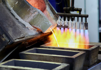 Molten Silver Poured Into Ingots