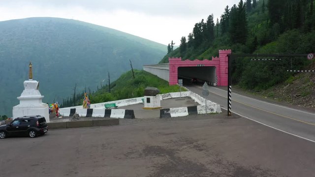 On a dangerous mountain road going cars in Siberia removed from the quadcopter