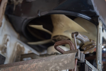 a professional electrician is cleaning the window air conditioner