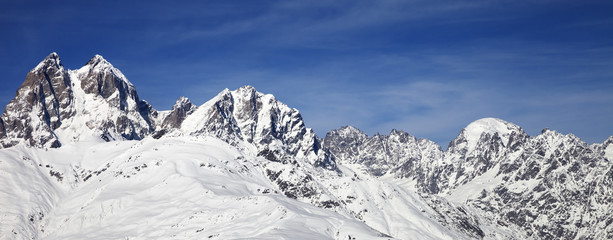 Fototapeta na wymiar Mount Ushba in winter at wind sunny day