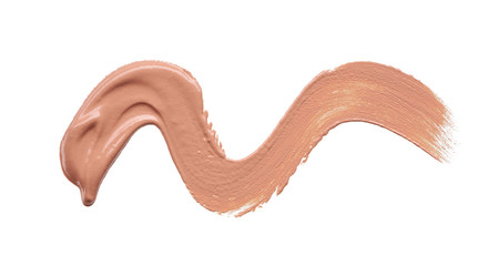 Gently beige strokes and texture of makeup foundation or acrylic paint isolated on white background