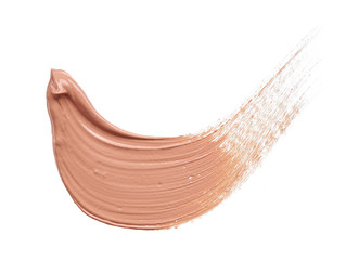 Gently beige strokes and texture of makeup foundation or acrylic paint isolated on white background