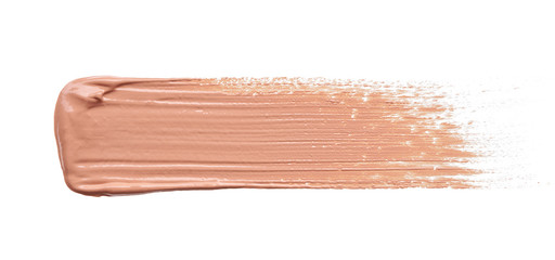 Gently beige strokes and texture of makeup foundation or acrylic paint isolated on white background