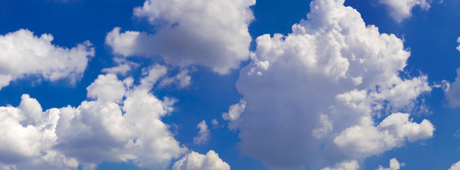 White clouds against a blue sky.