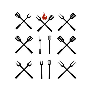 Set of barbecue tools icon. Fork and spatula for barbecue grill logo