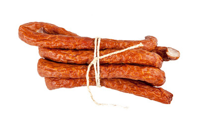 Smoked traditional kabanos on a white background