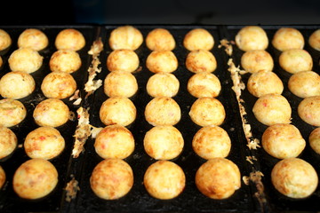 Tokyo,Japan-August 16, 2019: Takoyaki or octopus balls or octopus dumplings on cast iron