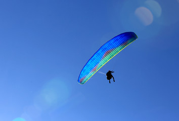 flying paraglider in sky