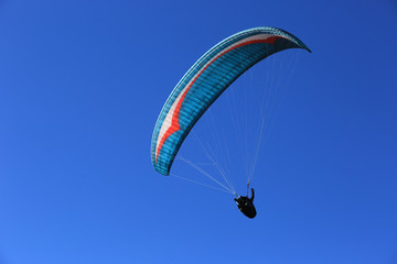 flying paraglider in sky