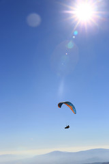 flying paraglider in sky