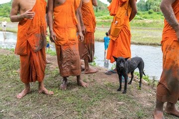 Dirty dress of novice monks after working on rice field in Chau Doc, Mekong delta, Vietnam