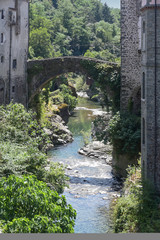 Fototapeta na wymiar Magra River with the ancient bridge in Bagnone, a small town in Tuscany, Italy