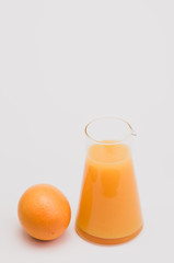 orange and fresh orange juice in a glass jar - food and drinks backdrops