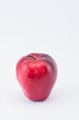 ripe red apple on a white background - natural nutrition
