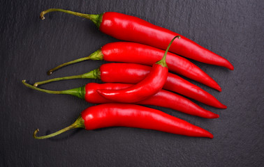 Fresh Chili pepper on dark background. View from above
