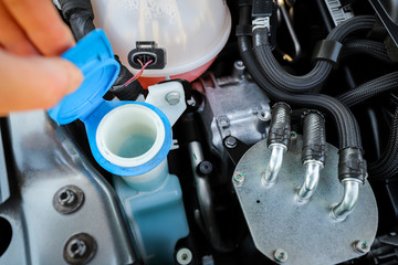 Open the car washer fluid cap to check the remaining capacity