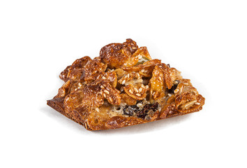 Hand-made cookies with honey and caramel on a white background