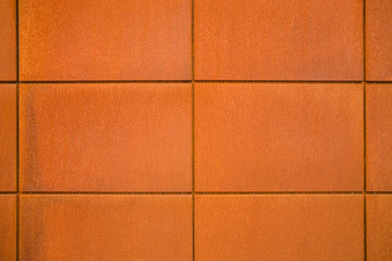 Naklejka premium Cortenstahl Hintergrund Fassadenplatten aus Eisenblech mit Rost im Industrie Stil - Background facade panels of sheet iron with rust in industrial style
