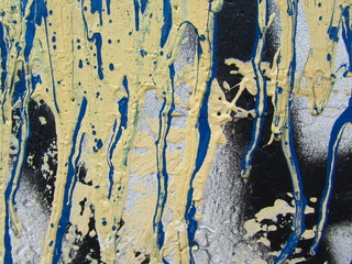 Leaked paint. Paint flowed. Stains of paint on a concrete wall outdoors . Expressionism pattern....