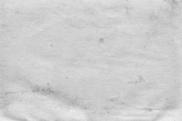 Cardboard white texture close-up. Light old paper background. Grunge concrete wall. Vintage blank wallpaper.