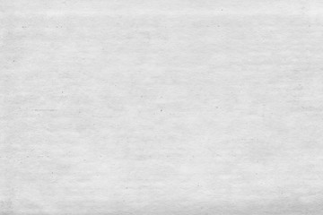 Cardboard white texture close-up. Light old paper background. Grunge concrete wall. Vintage blank wallpaper.