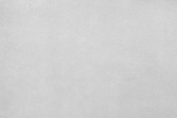 Cardboard white texture close-up. Light old paper background. Grunge concrete wall. Vintage blank wallpaper.