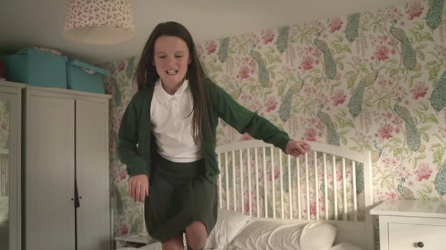 Young school girl getting ready in the morning to go to school
