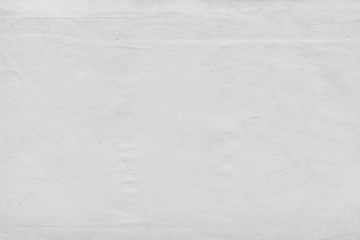 Cardboard white texture close-up. Light old paper background. Grunge concrete wall. Vintage blank wallpaper.