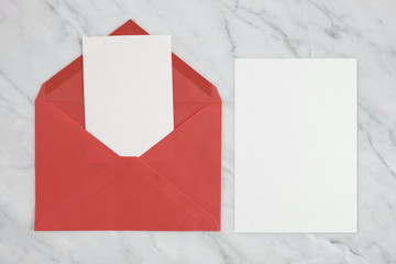 Luxury Wedding invitation mock-up card with paper and envelope, roses, gifts, Eucalyptus, ribbon on white marble background, top view, flat lay