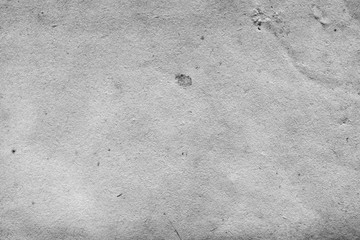 Cardboard white texture close-up. Light old paper background. Grunge concrete wall. Vintage blank wallpaper.