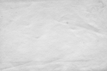 Cardboard white texture close-up. Light old paper background. Grunge concrete wall. Vintage blank wallpaper.