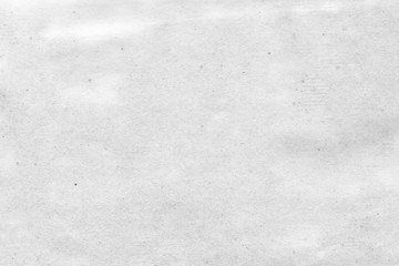 Cardboard white texture close-up. Light old paper background. Grunge concrete wall. Vintage blank wallpaper.