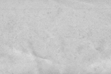 Cardboard white texture close-up. Light old paper background. Grunge concrete wall. Vintage blank wallpaper.