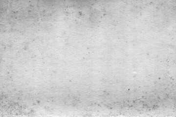 Cardboard white texture close-up. Light old paper background. Grunge concrete wall. Vintage blank wallpaper.