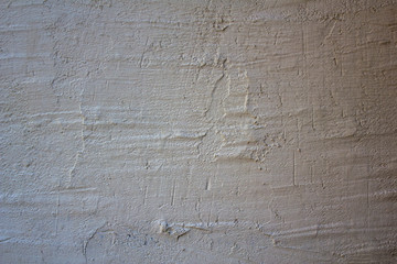 old white gray concrete wall with deep scratches and shadow. rough surface texture