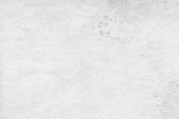 Cardboard white texture close-up. Light old paper background. Grunge concrete wall. Vintage blank wallpaper.