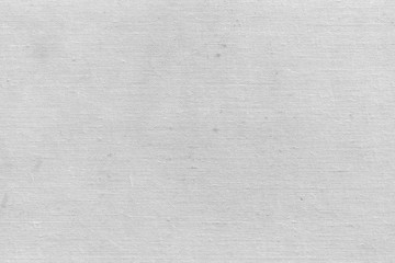 Cardboard white texture close-up. Light old paper background. Grunge concrete wall. Vintage blank wallpaper.