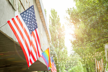 Flags of America and the LGBT community on the building. Sexual minorities in USA.