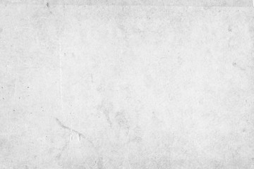 Cardboard white texture close-up. Light old paper background. Grunge concrete wall. Vintage blank wallpaper.