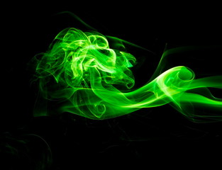 Green smoke on black background