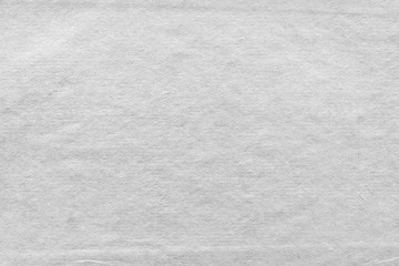Cardboard white texture close-up. Light old paper background. Grunge concrete wall. Vintage blank wallpaper.