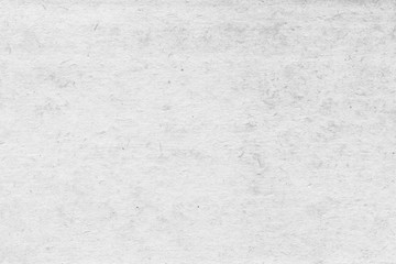 Cardboard white texture close-up. Light old paper background. Grunge concrete wall. Vintage blank wallpaper.