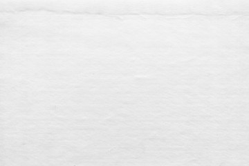 Fototapeta premium Cardboard white texture close-up. Light old paper background. Grunge concrete wall. Vintage blank wallpaper.